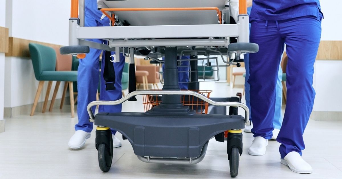 Gurney being pushed into an emergency room